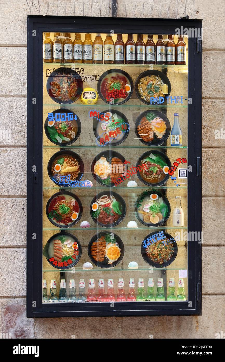 Board showing photos of dishes outside Japanese restaurant, Tarragona, Spain Stock Photo
