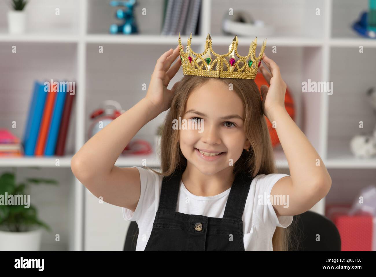 happy child wear queen crown at school classroom Stock Photo Alamy