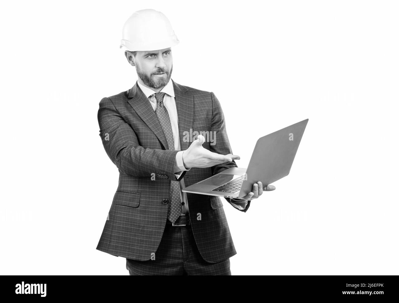 Professional engineer in hardhat point at laptop screen for engineering, computer software Stock Photo