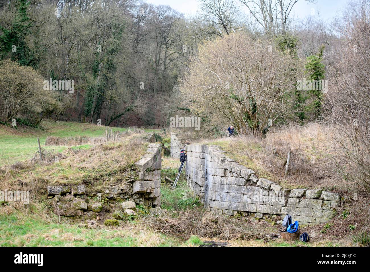 Members of the Somersetshire Coal Canal Society work on restoring the remains of a lock flight near Combe Hay, UK Stock Photo