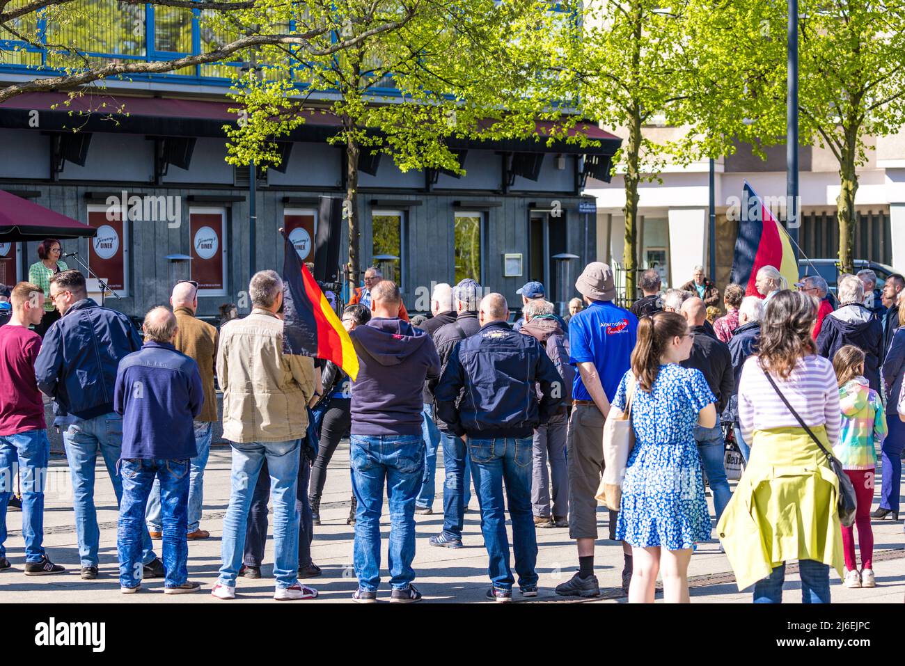 01 May 2022, Brandenburg, Cottbus: Visitors listen to a speaker at an ...