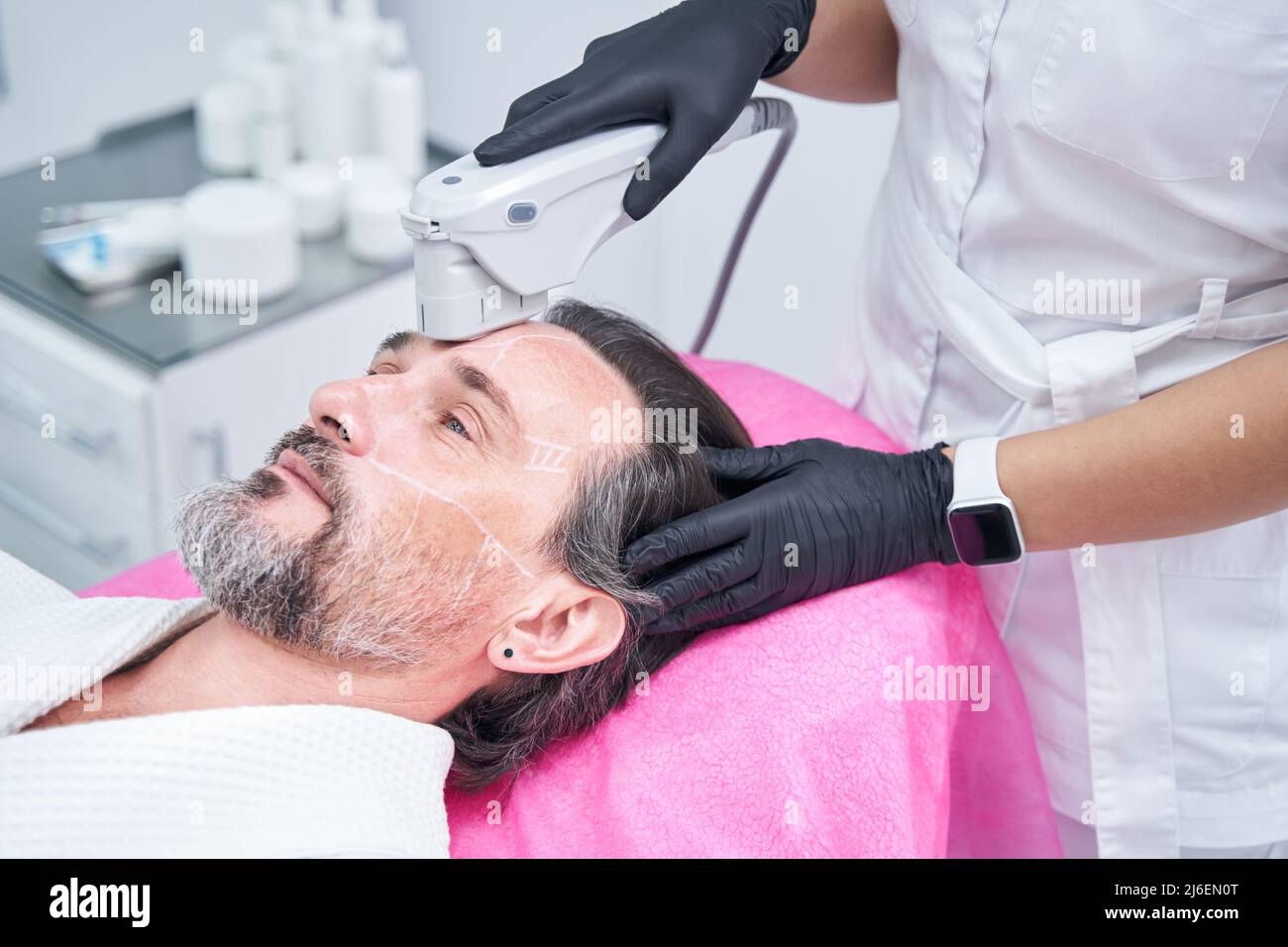 Skinologist Setup Professional cosmetologist doing skincare procedure for patient Stock ...