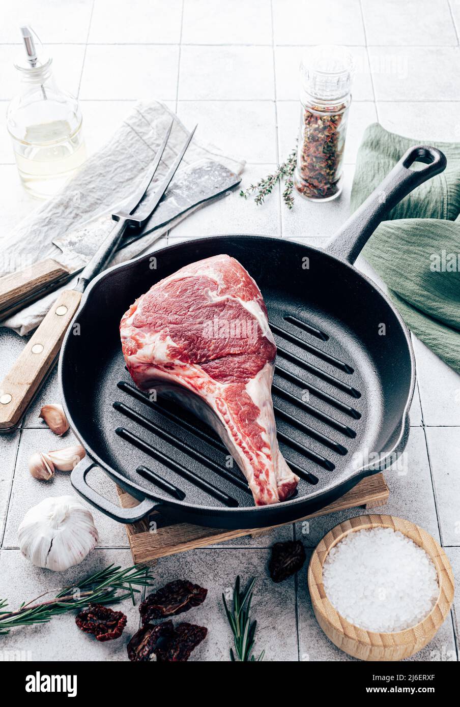 Tomahawk steak on grill pan. Cooking concept Stock Photo