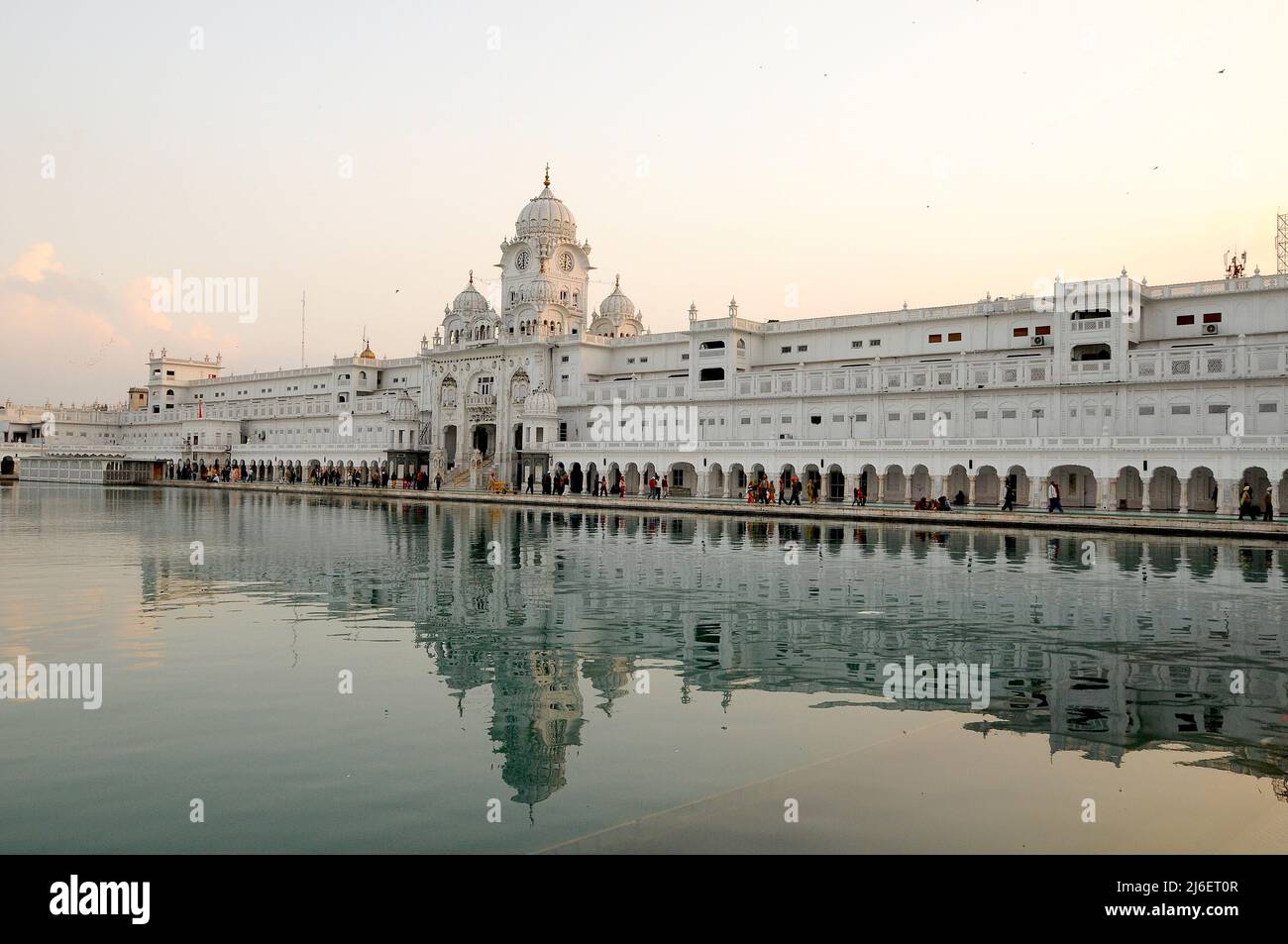 The golden temple of Sikh religion at sunset in Amritsar, Punjab, India. Stock Photo