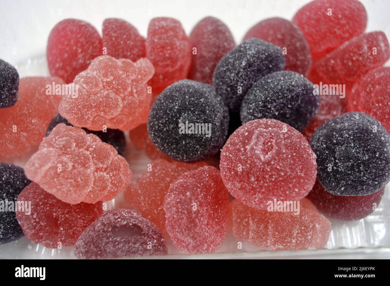 Bright cherry, red, purple, pink, delicious candies in the form of ...