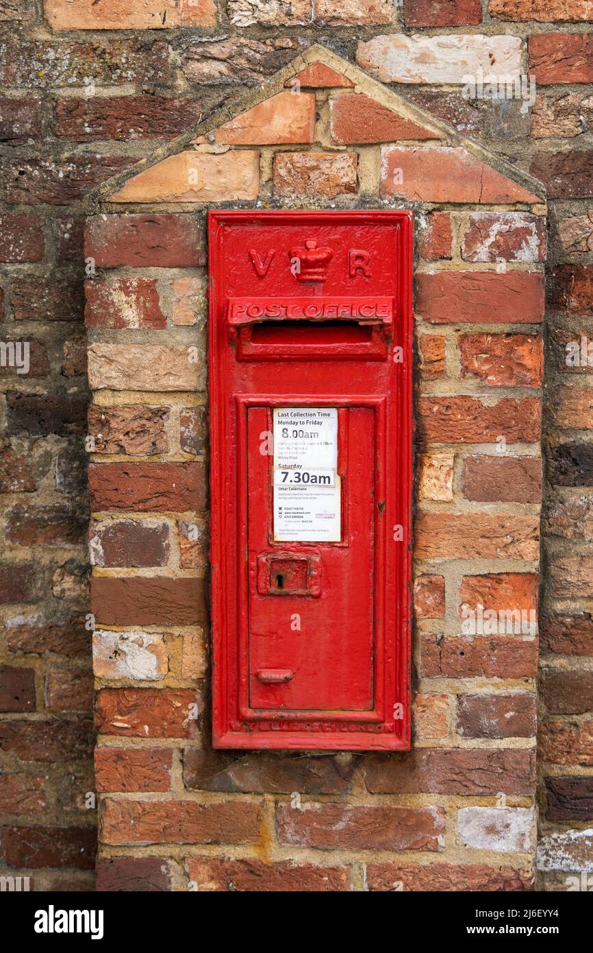 Poole, Dorset, United Kingdom - April 14 2022: Victorian era Post Box mounted within the Brownsea outer walls. Stock Photo