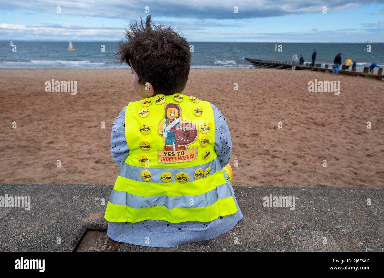 A young SNP supporter waits for the First Minister of Scotland Nicola