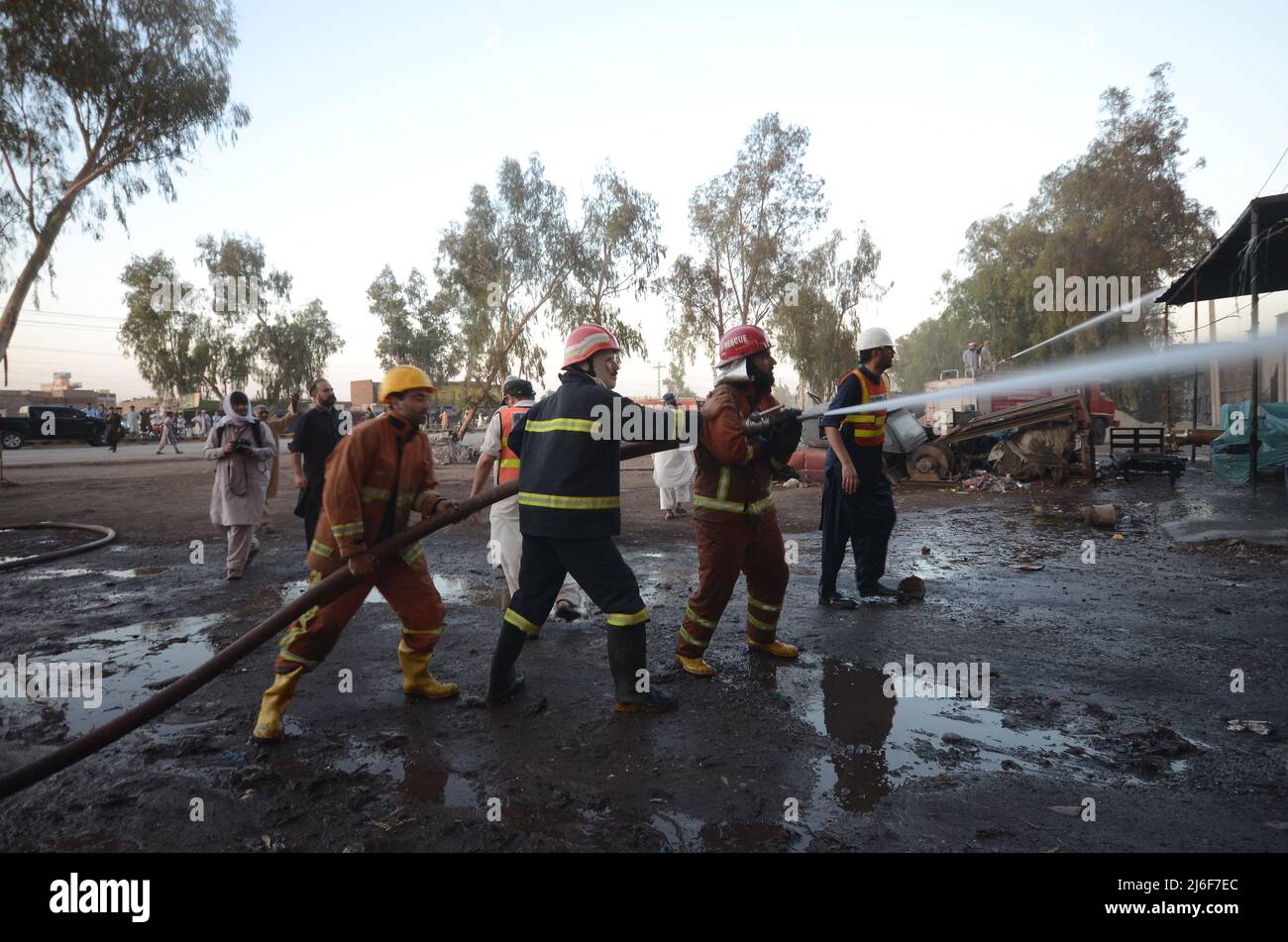 Firefighters try to extinguish the fire broke out at an oil tanker ...