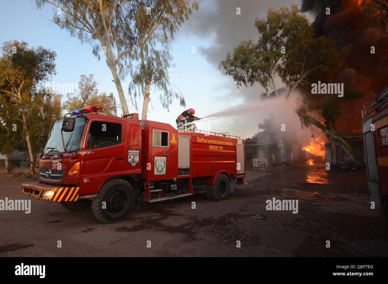 Firefighters try to extinguish the fire broke out at an oil tanker ...