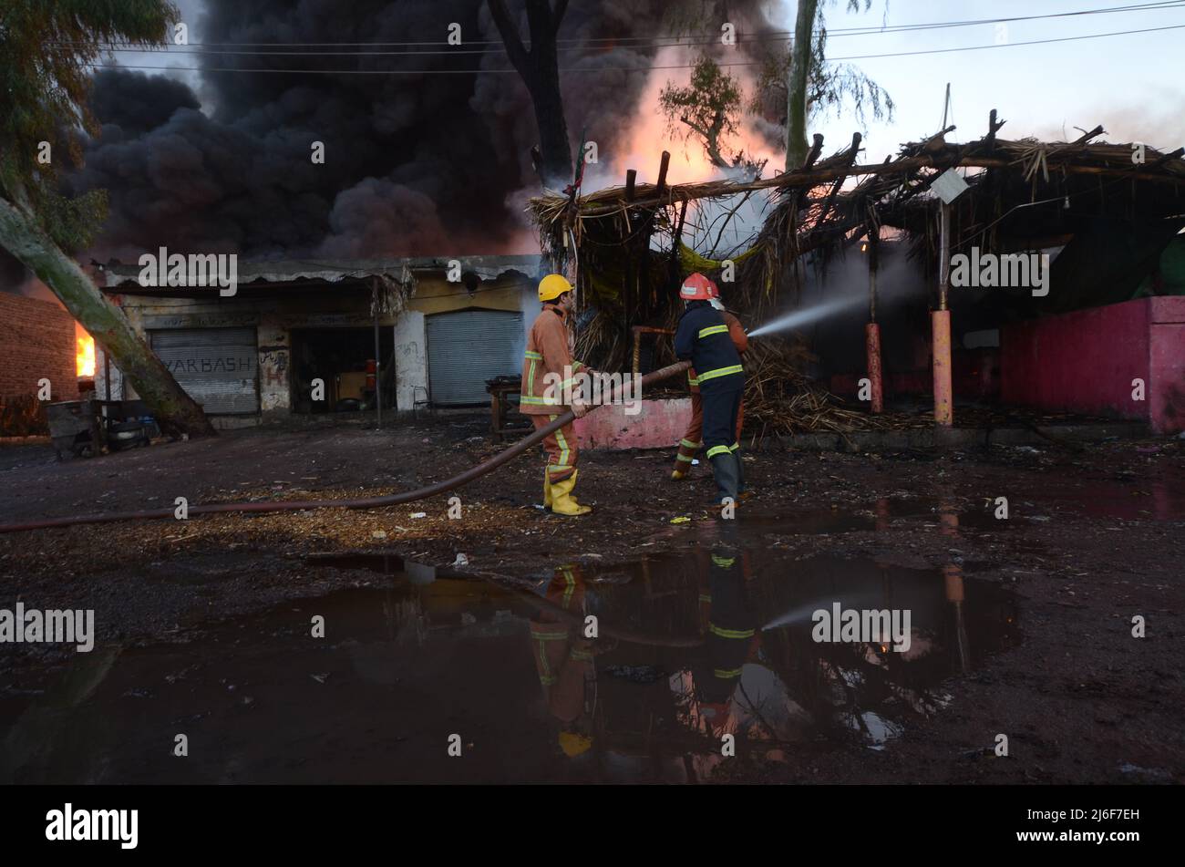 Firefighters try to extinguish the fire broke out at an oil tanker ...