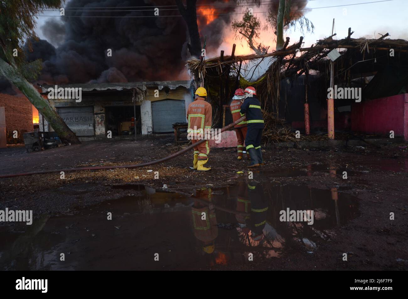 Firefighters try to extinguish the fire broke out at an oil tanker ...