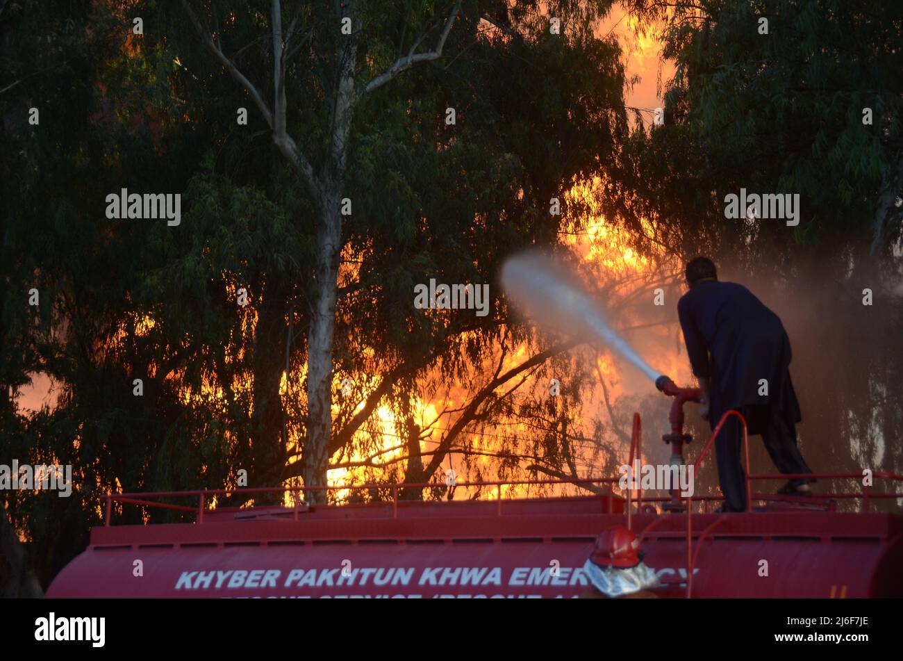 Firefighters try to extinguish the fire broke out at an oil tanker ...