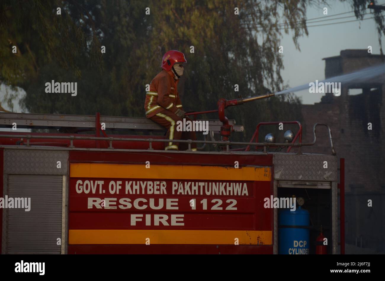 Firefighters try to extinguish the fire broke out at an oil tanker ...