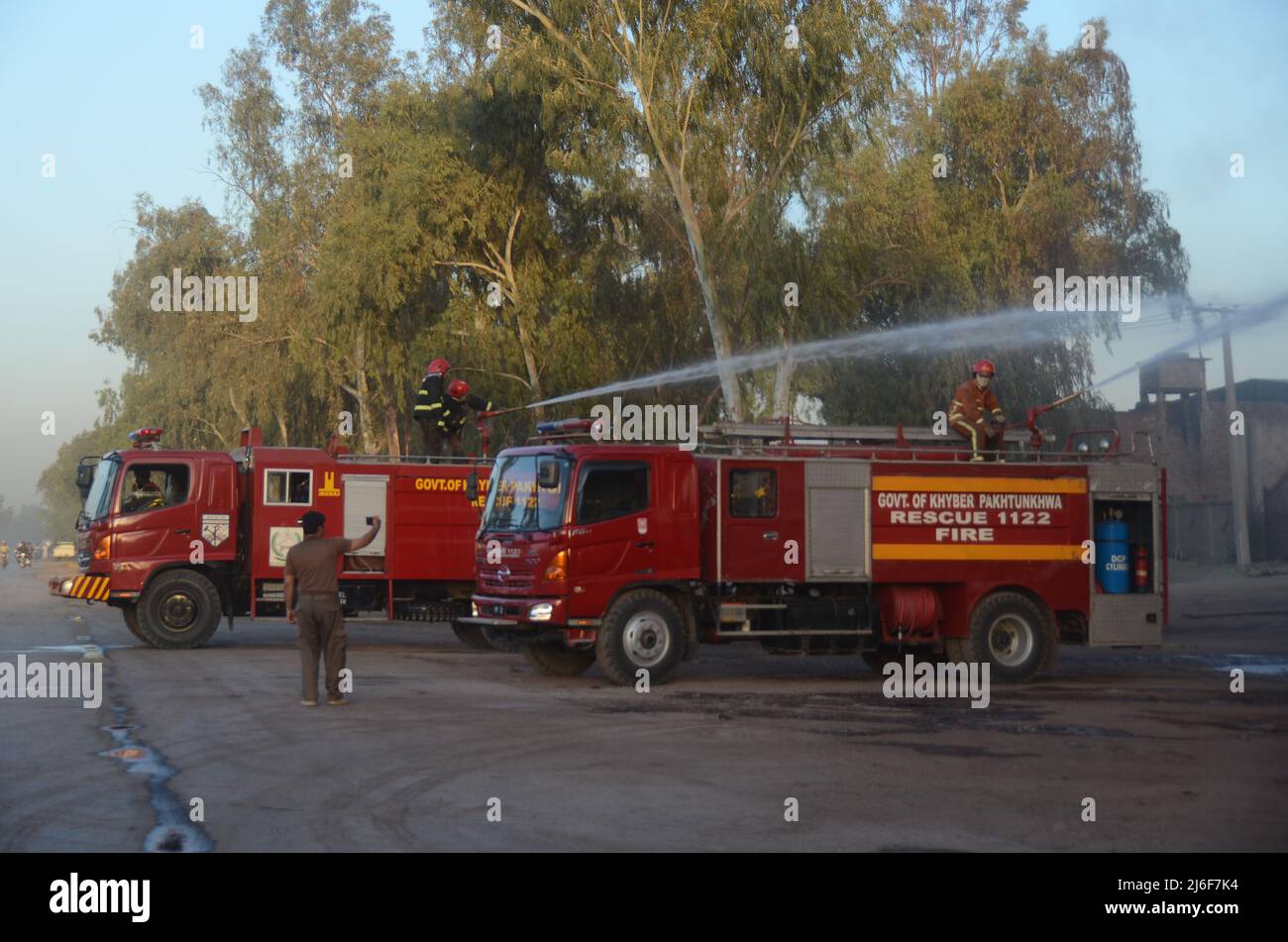 Firefighters try to extinguish the fire broke out at an oil tanker ...