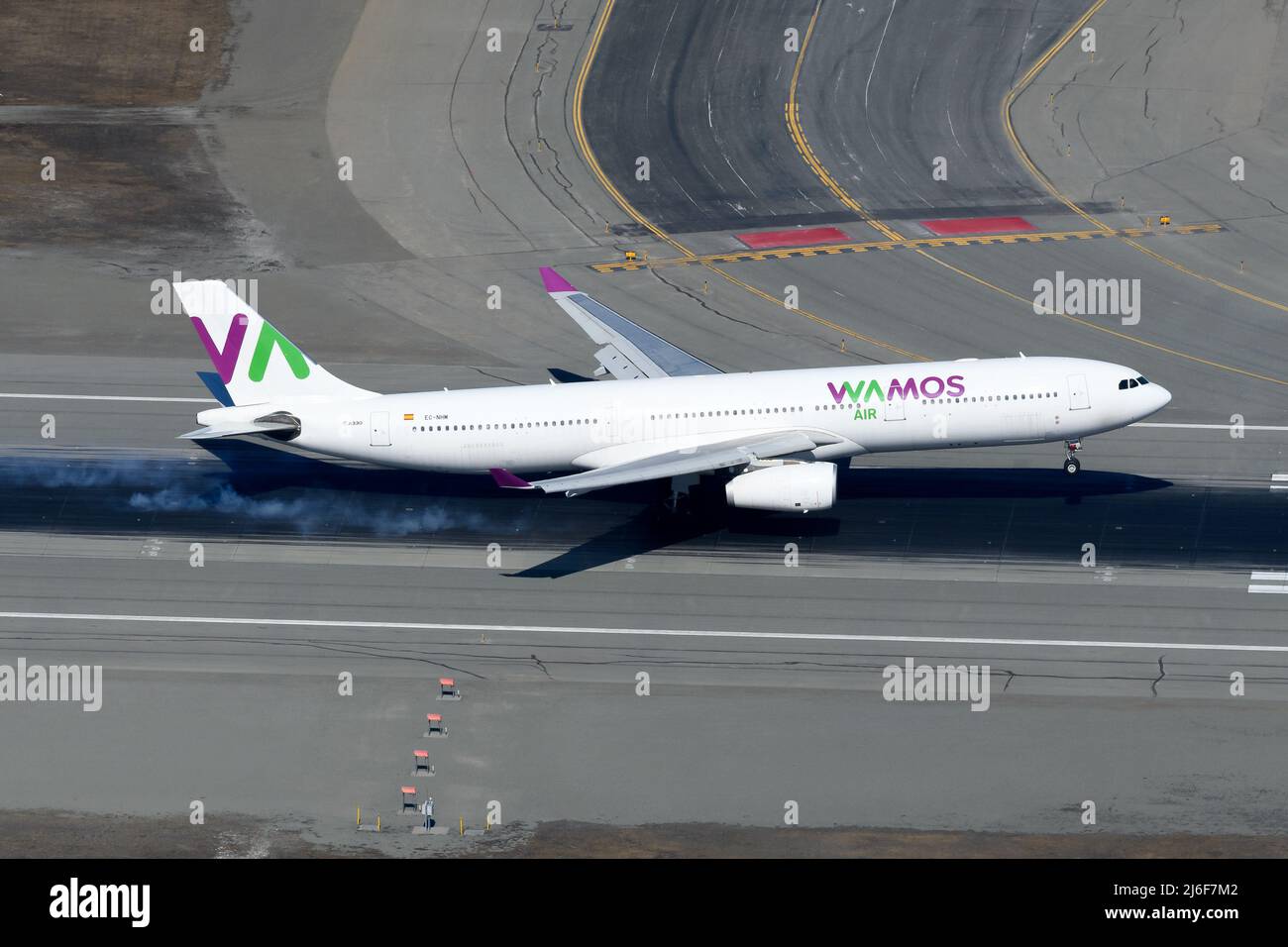Wamos Air Airbus A330-300 airplane landing. A330 plane of charter airline WamosAir. Aircraft registered as EC-NHM. Stock Photo