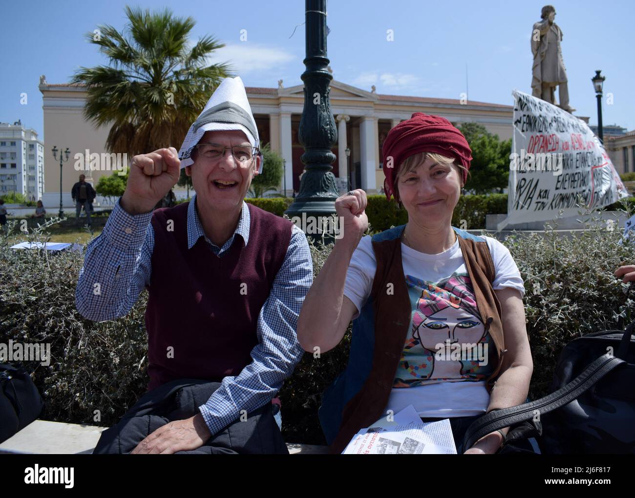 Athens, Greece, 1 May 2022. A couple of protesters gesture while participating the rally to mark International Workers Day. Thousands of Greek workers took to the streets to honor International Labour Day and protest over high prices and energy costs plaguing households as the conflict in Ukraine takes its toll on European economies. Credit: Dimitris Aspiotis / Alamy Live News Stock Photo