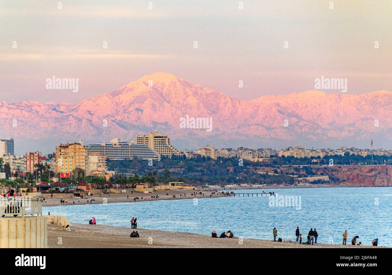 Alpine glow in the snow-capped peaks of the Taurus Mountains seen from Konyaalti beach Stock Photo