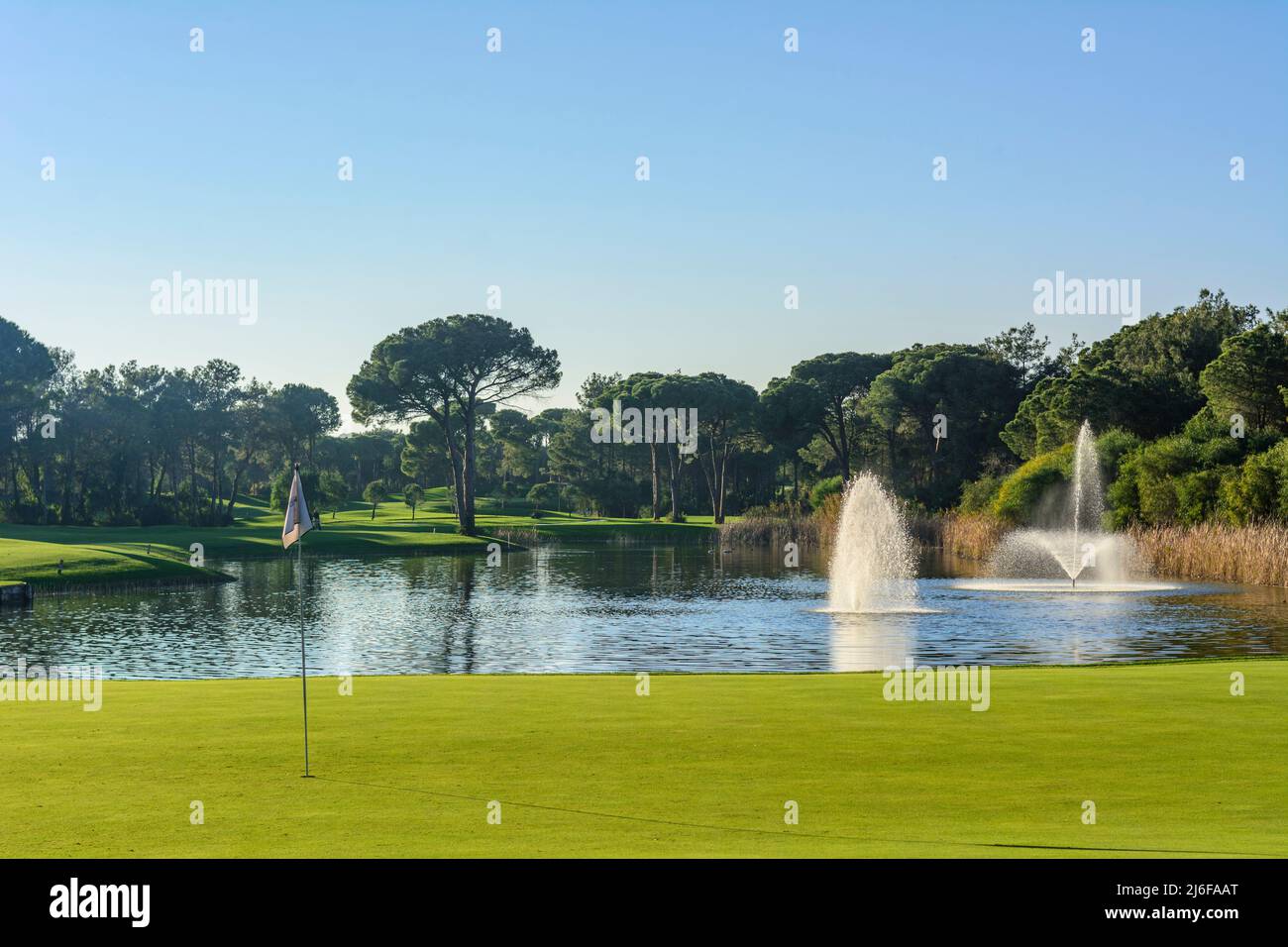 Beautiful evening sun on golf course Stock Photo