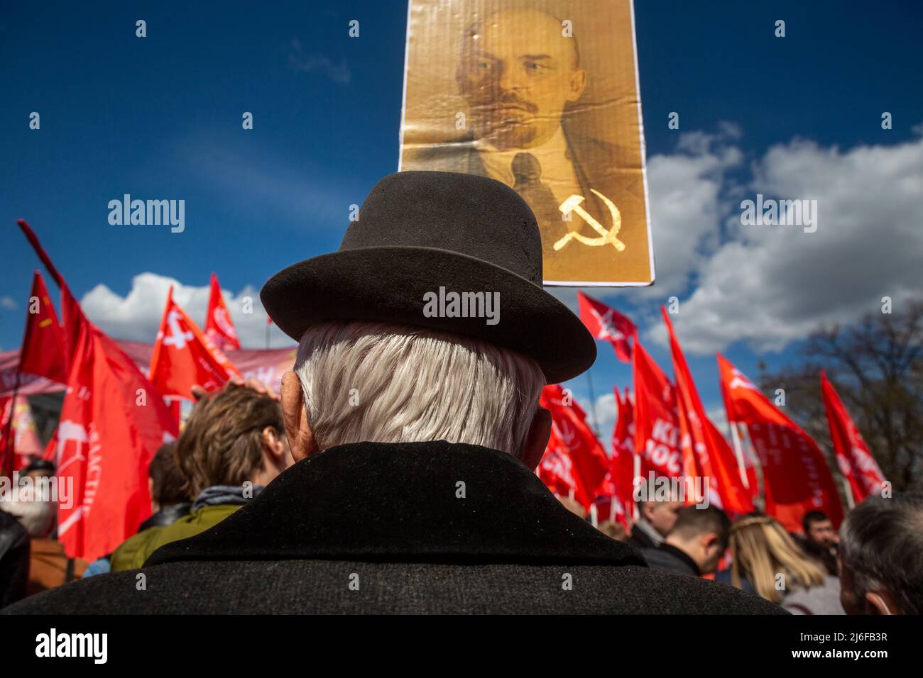 Moscow, Russia. 1st May, 2022. A supporter of the Russian Communist Party holds a portrait of Soviet leader Vladimir Lenin during a May Day rally in Moscow, Russia Stock Photo
