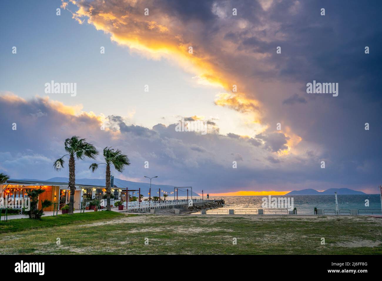 cafe by the sea. restaurant on the beach at sunset Stock Photo