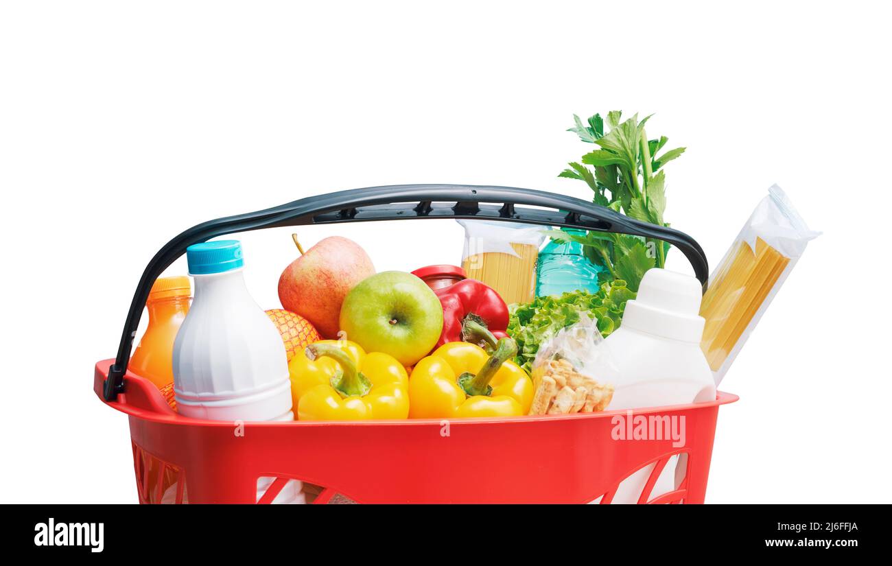 Shopping basket filled with goods isolated on white background Stock Photo