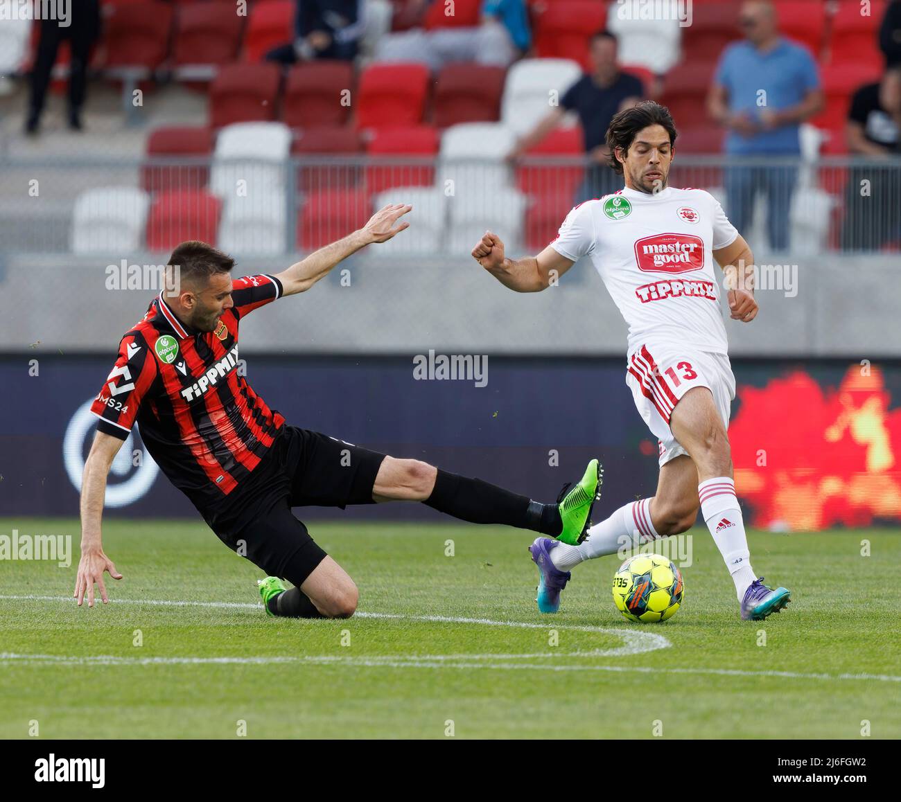 BUDAPEST, HUNGARY - MARCH 6: Claudiu Bumba of Kisvarda Master Good  challenges Henry Wingo of Ferencvarosi TC during the Hungarian OTP Bank  Liga match between Ferencvarosi TC and Kisvarda Master Good at