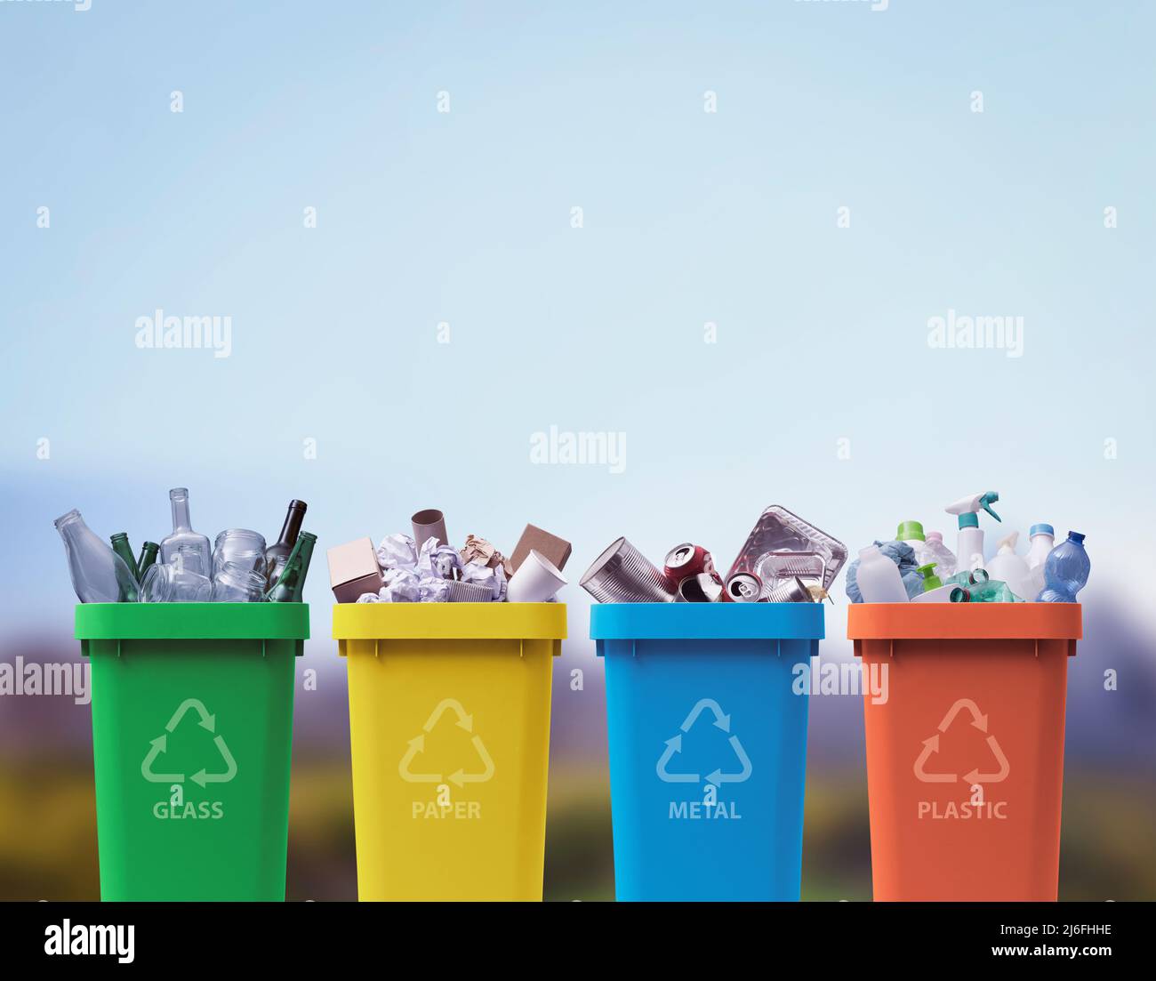 Collection of waste bins full of different types of garbage, recycling and separate waste