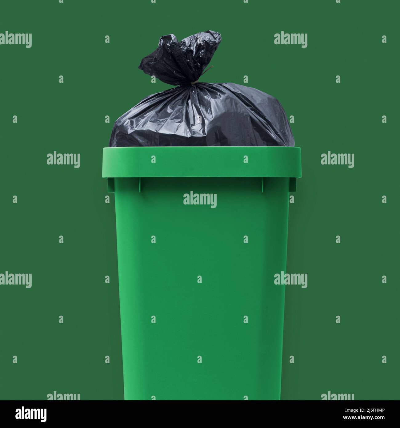 Garbage bag in a open trash bin, waste management and recycling concept