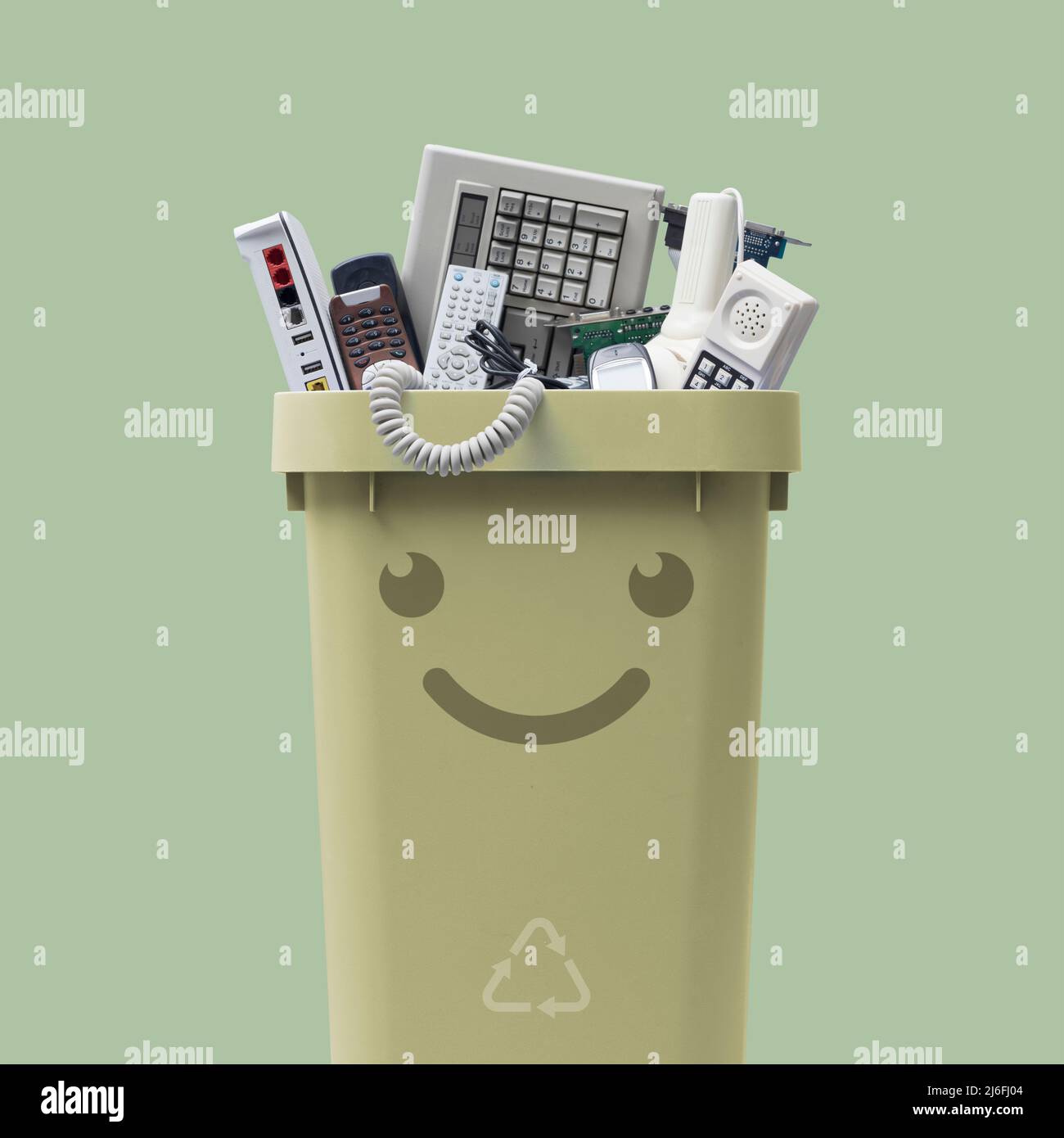 Recycling bin full of electronic waste, smiling cute character Stock