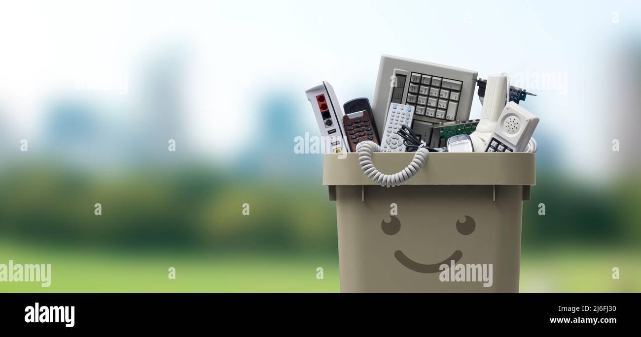 Recycling bin full of electronic waste, smiling cute character Stock