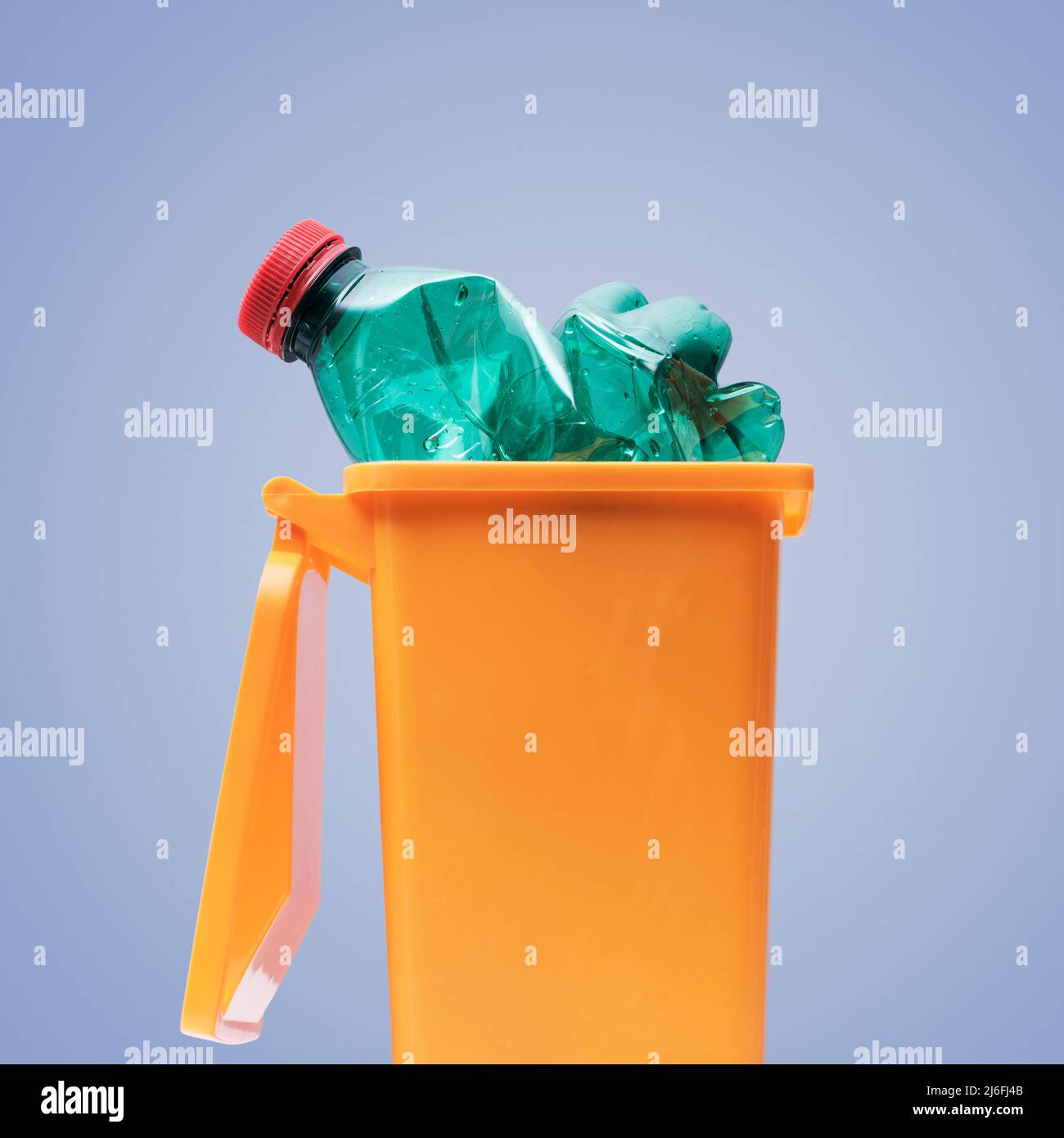 Plastic bottle in a small garbage can, recycling and separate waste