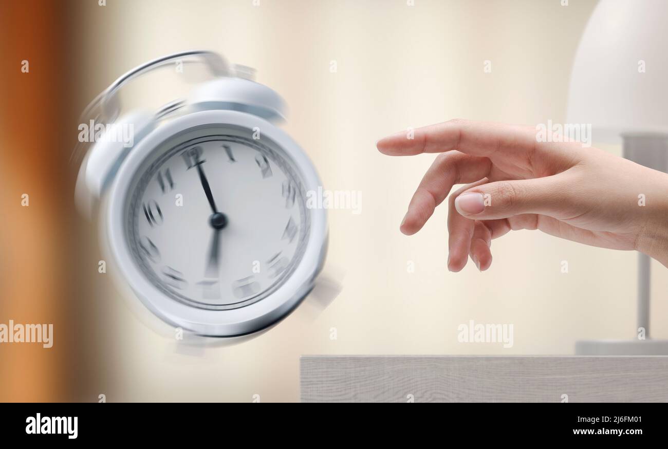 Female hand turning off a ringing vintage twin bell alarm clock Stock ...