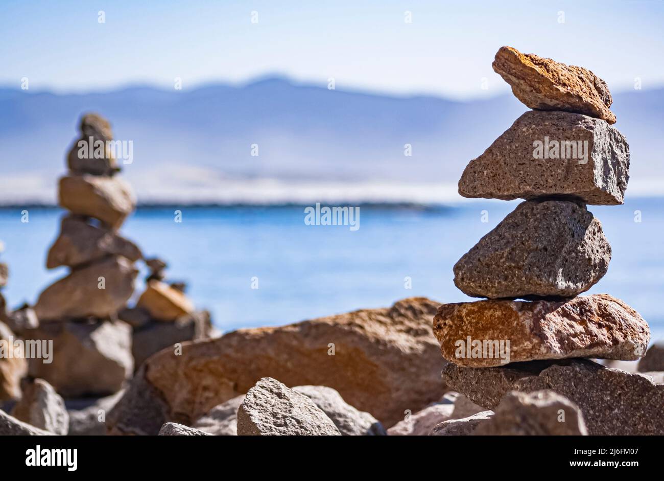 Stacked rocks balanced on the beach Stock Photo Alamy