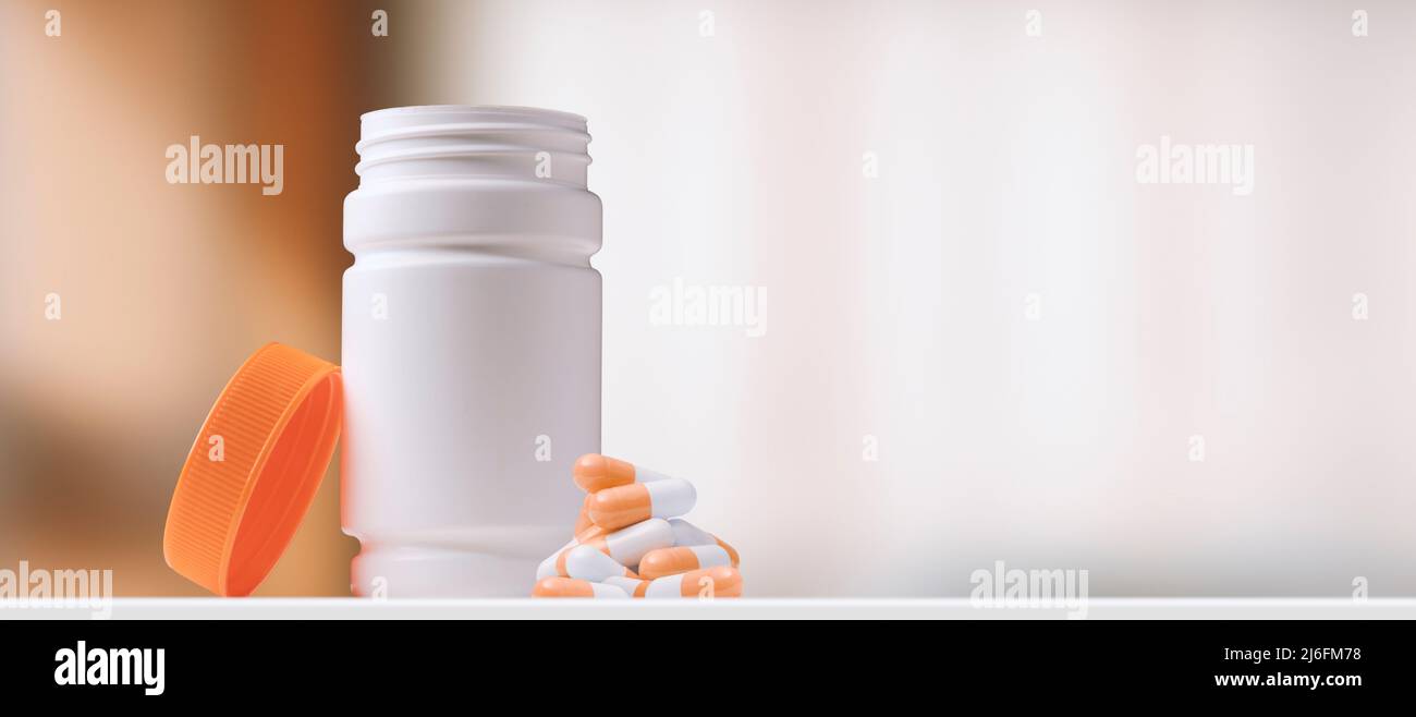 Open pill bottle and capsules, medicine and drugs concept Stock Photo Alamy