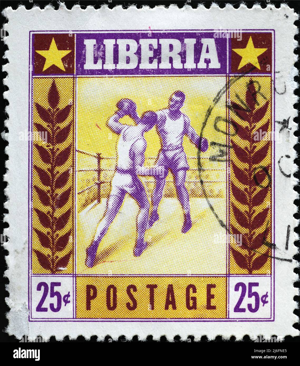 Boxers in action on vintage polish stamp from Liberia Stock Photo