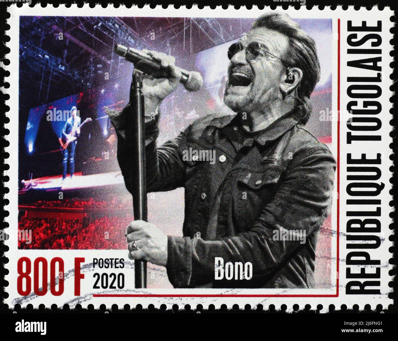 Bono in concet with the U2 on postage stamp Stock Photo