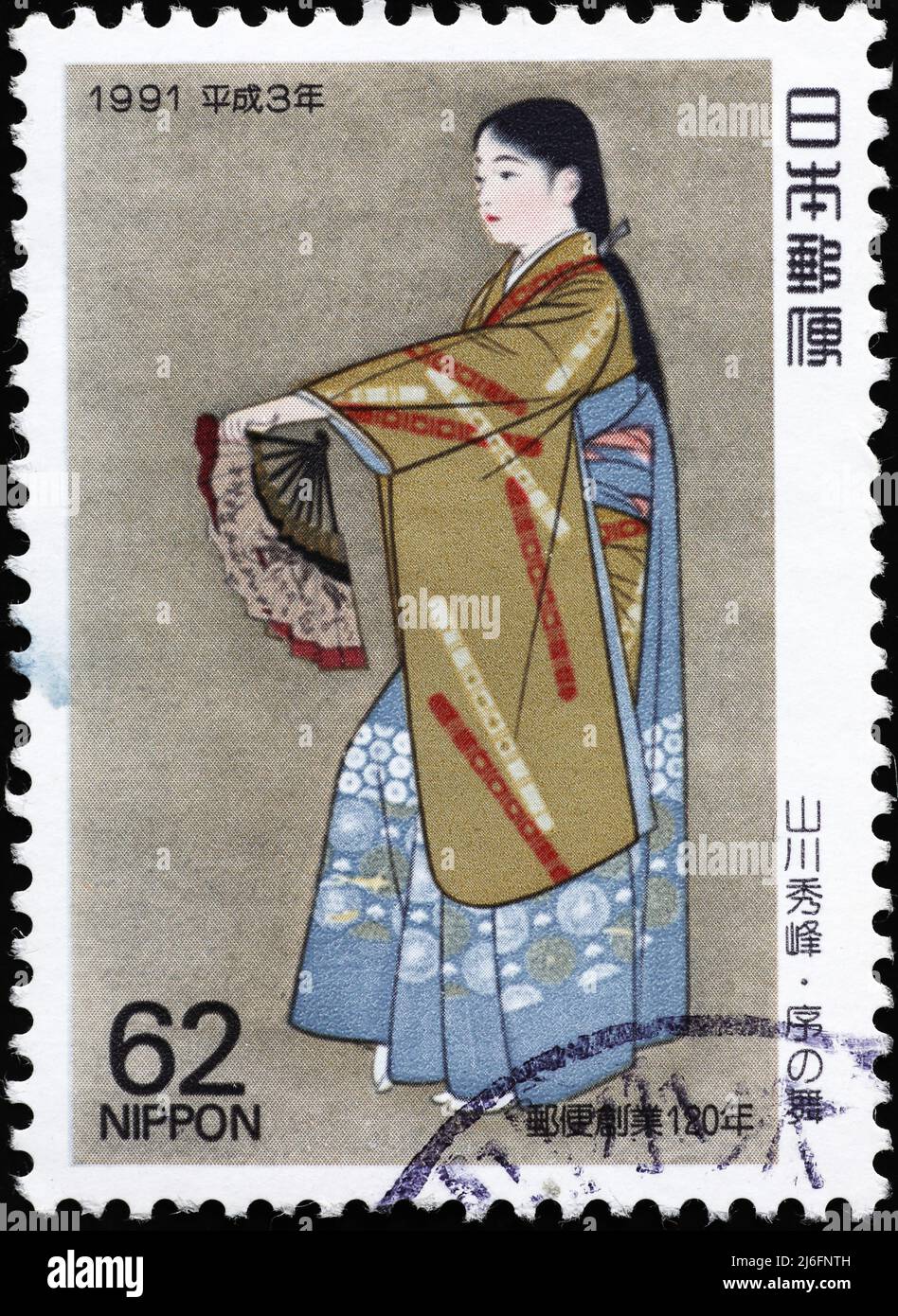 Elegant geisha on japanese postage stamp Stock Photo