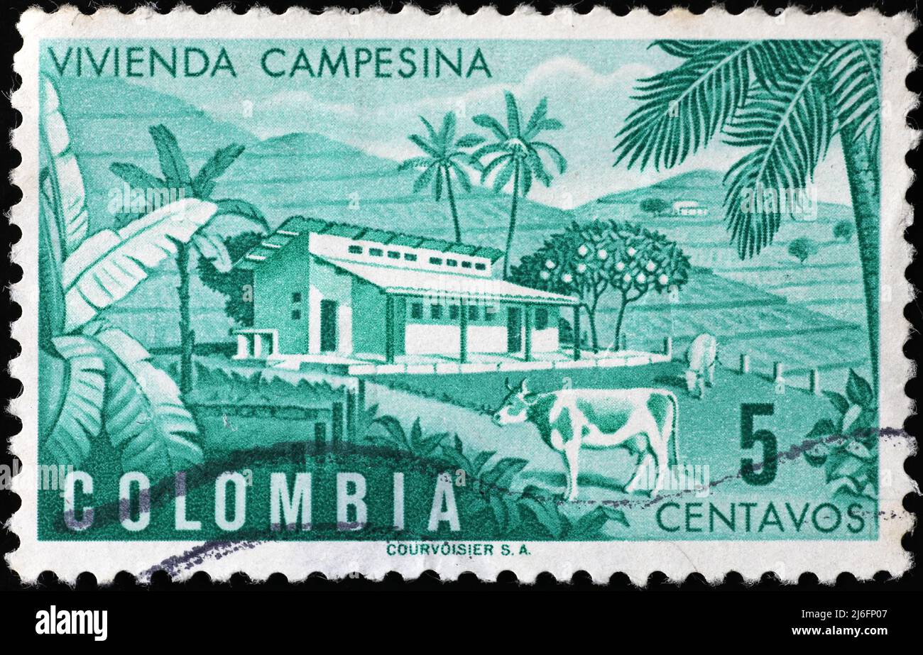 Farm on vintage postage stamp of Colombia Stock Photo