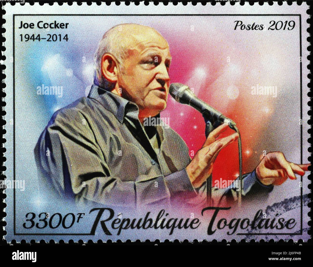 Joe Cocker in concert on postage stamp of Togo Stock Photo