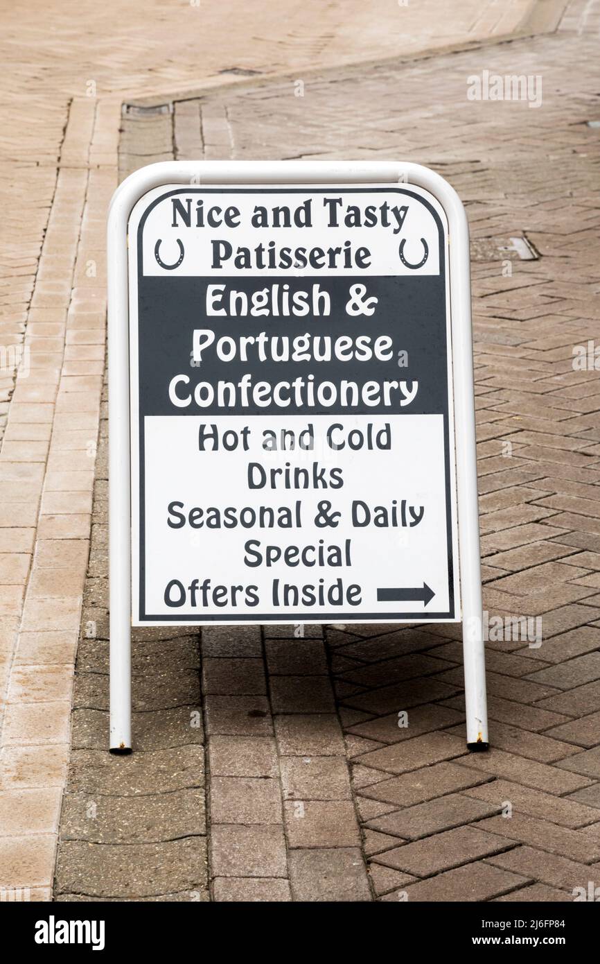 A sign for English & Portuguese Confectionery outside the Nice and Tasty Patisserie in King's Lynn, Norfolk. Stock Photo