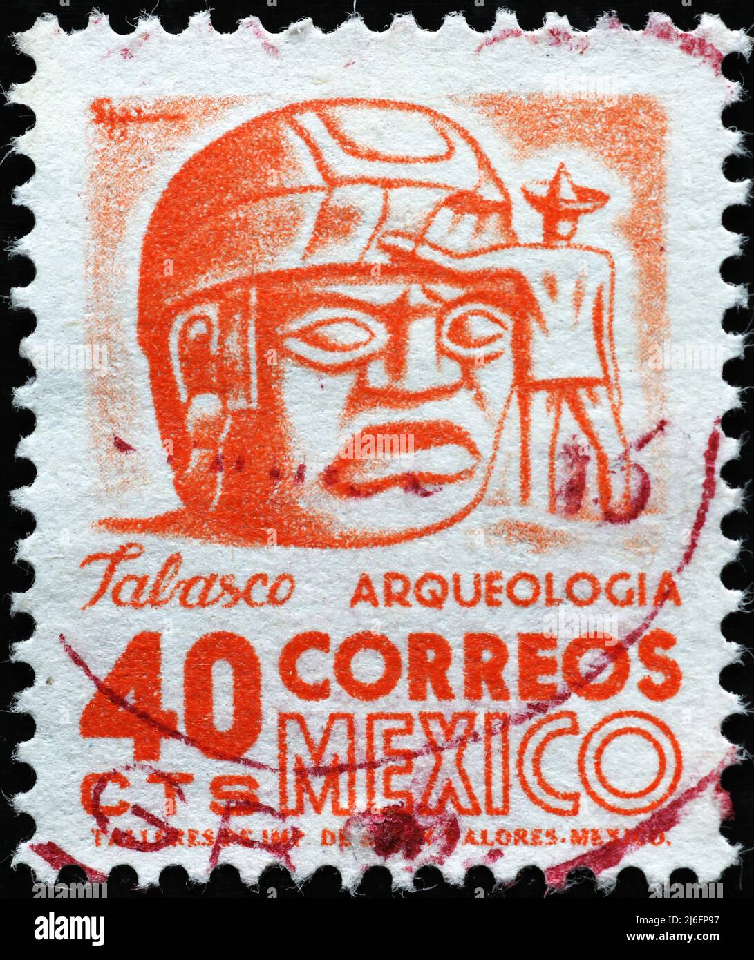Olmec colossal head on vintage mexican postage stamp Stock Photo