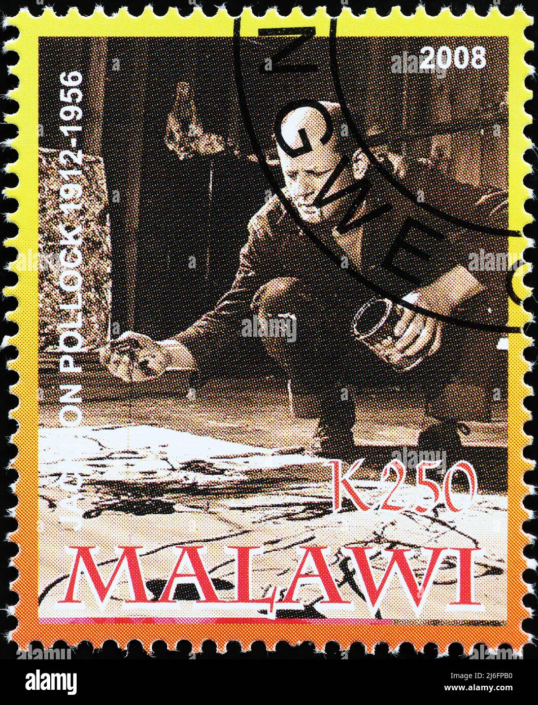 Picture of Jackson Pollock at work on postage stamp Stock Photo