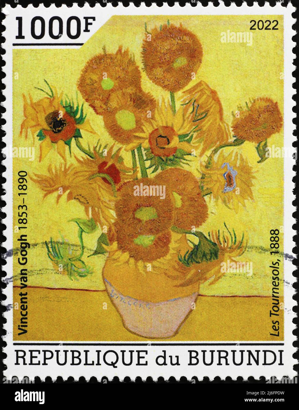 Pot of sunflowers painted by Van Gogh on postage stamp Stock Photo