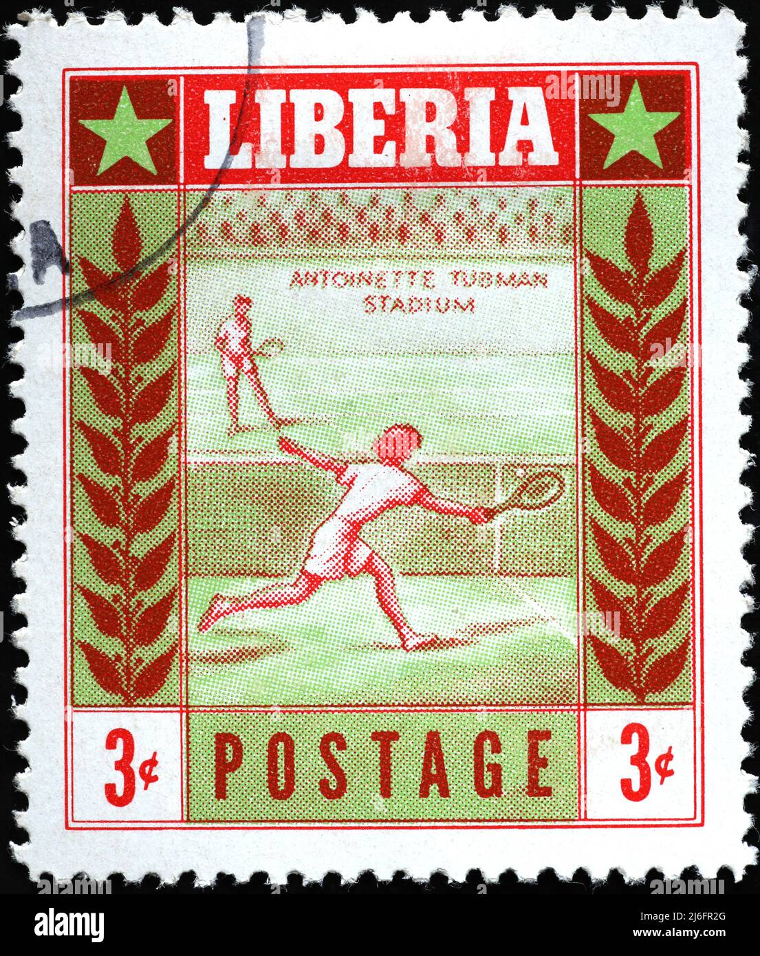 Tennis player on vintage stamp from Liberia Stock Photo