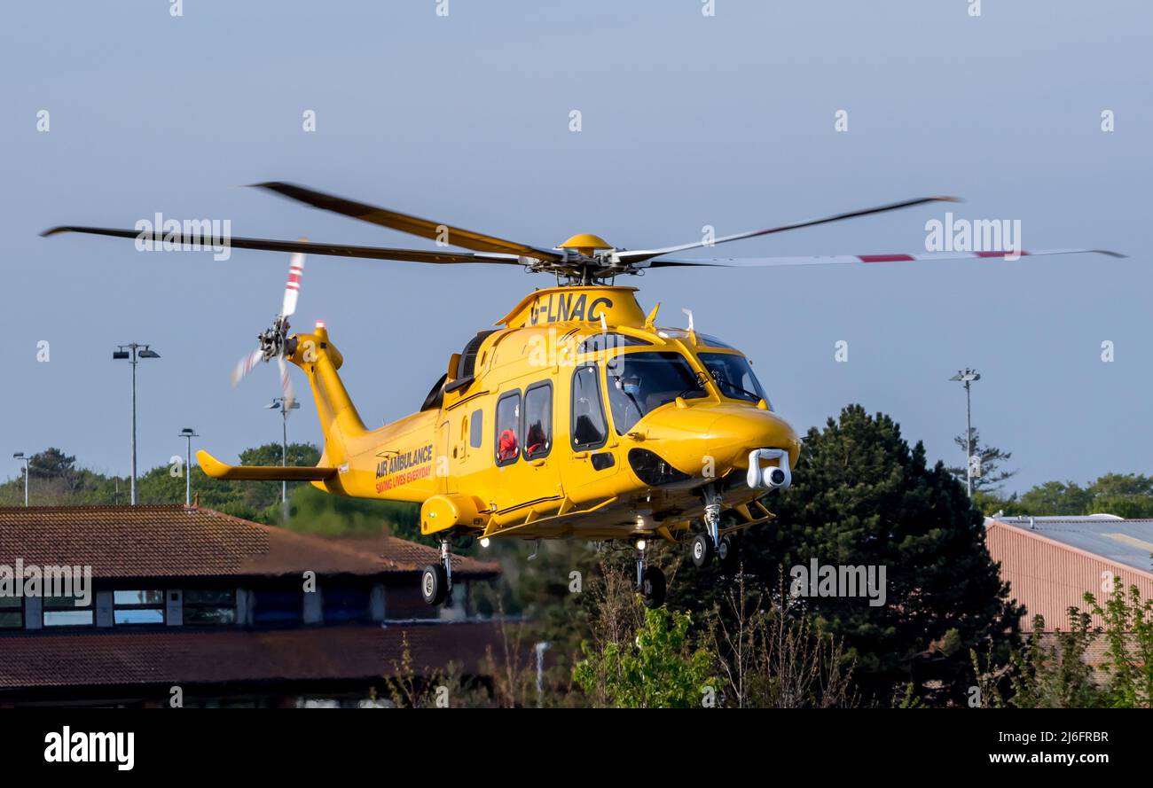 Air ambulance transports critically ill patient from Eastbourne hospital to suitably equipped medical facility. Stock Photo