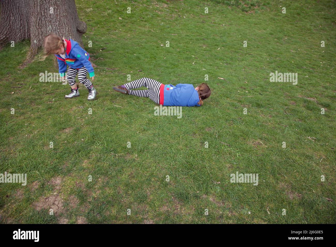 Kids playing rolly polly, UK Stock Photo - Alamy