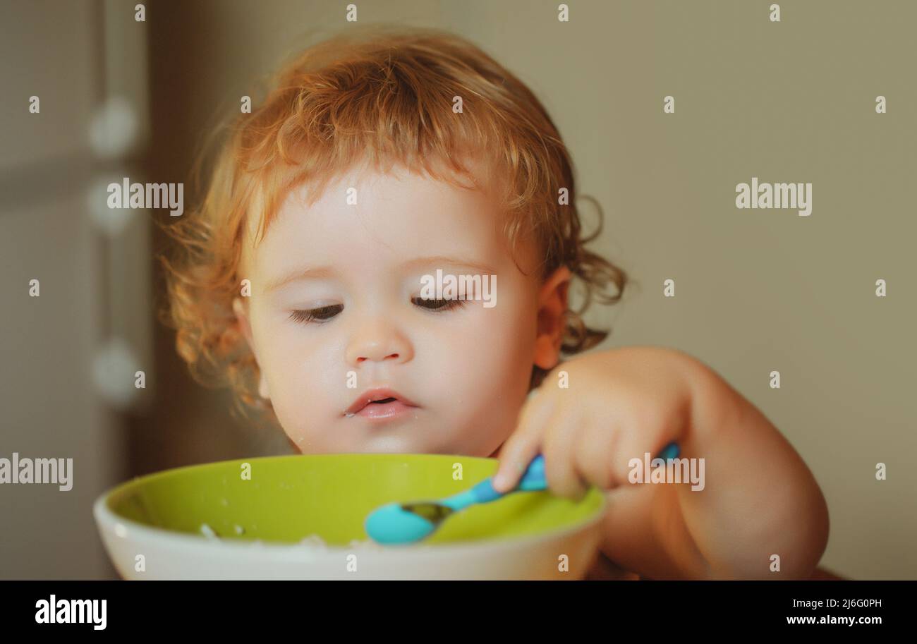 Healthy nutrition for kids. Family, food, child, eating and parenthood concept. Stock Photo