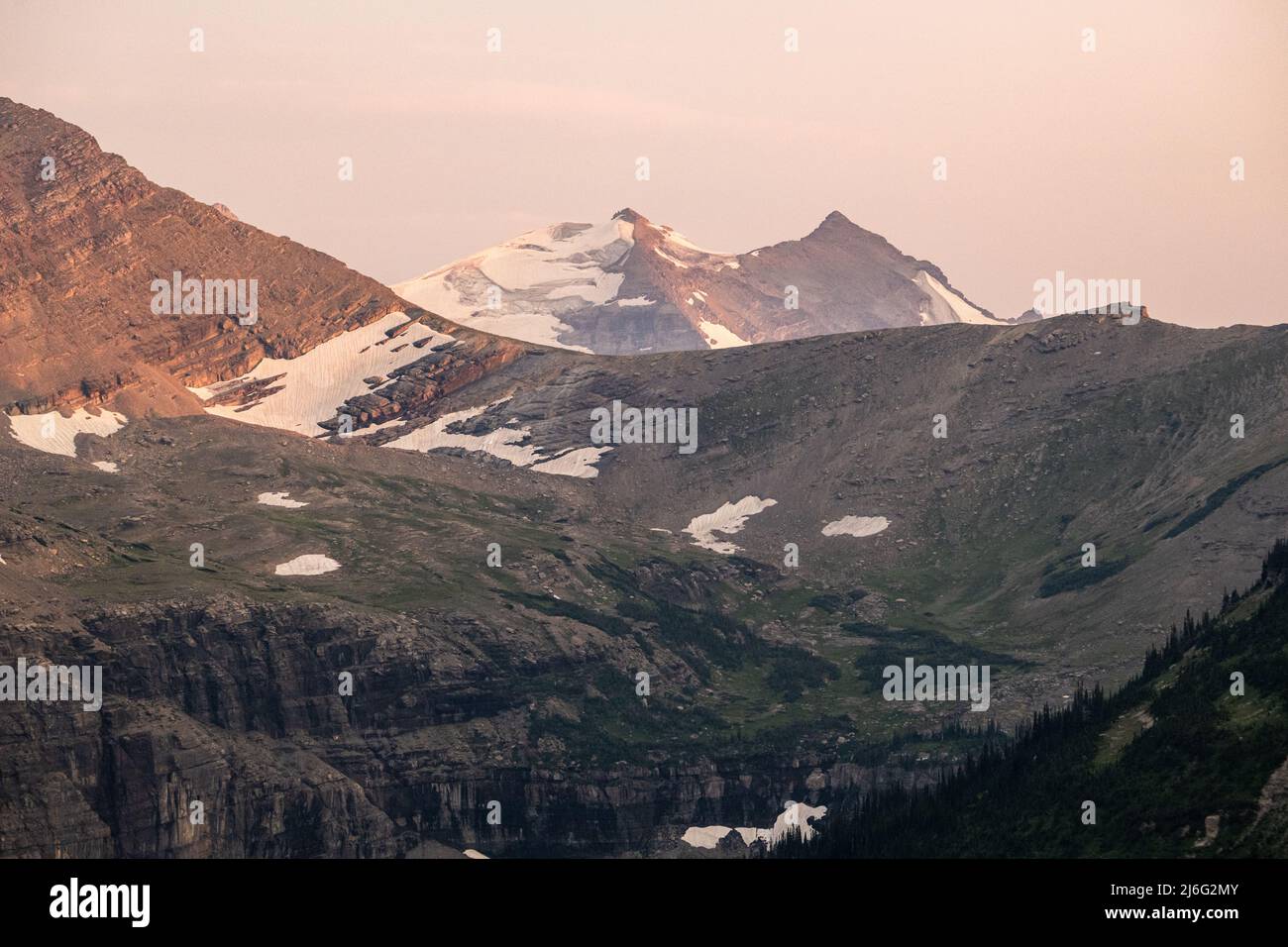 Last Sun of the Day Highlights Gunsight Mountain in Glacier National Park Stock Photo