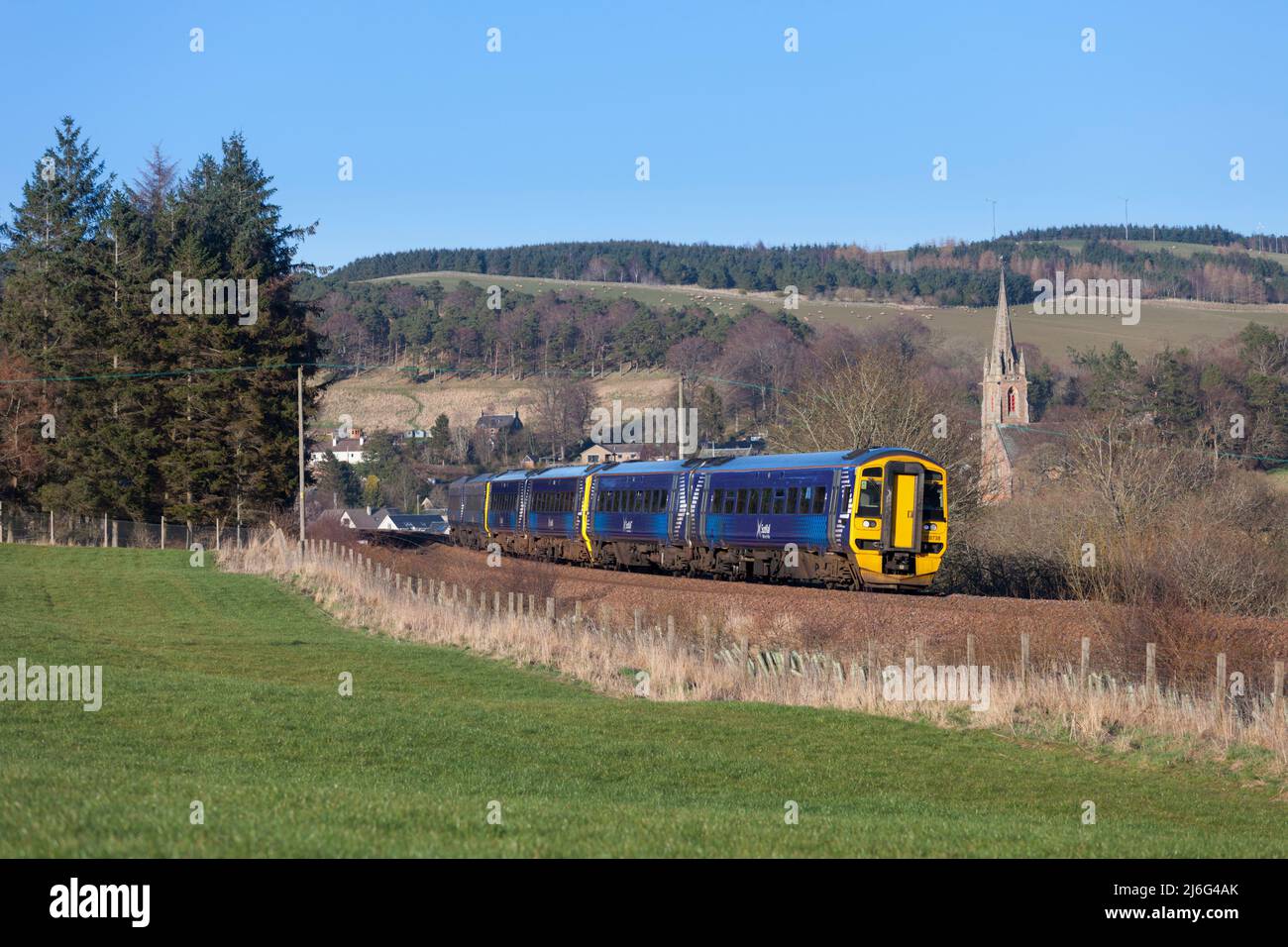 3 Scotrail class 158 DMU trains passing the countryside and Stow St