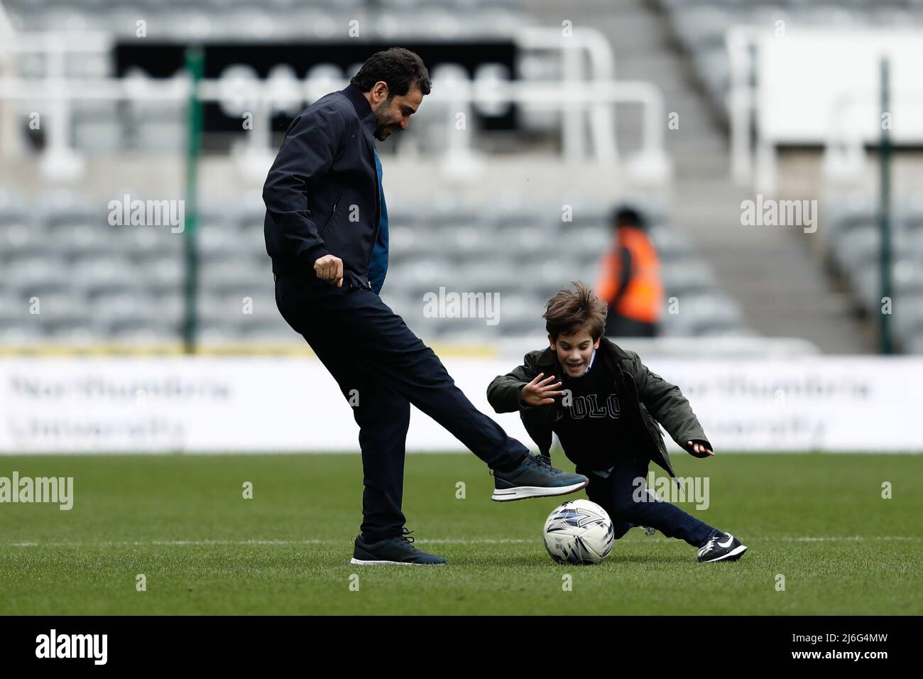 NEWCASTLE UPON TYNE, UK. MAY 2ND   Newcastle United Co-Owner, Mehdrad Ghodussi plays football with his son after the FA Women's National League Division One between Newcastle United and Alnwick Town at St. James's Park, Newcastle on Monday 2nd May 2022. (Credit: Will Matthews | MI News) Credit: MI News & Sport /Alamy Live News Stock Photo